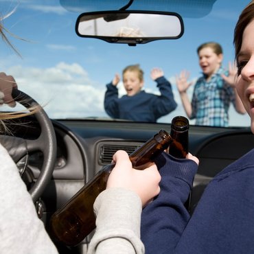 kids-crossing-front-car-drinking