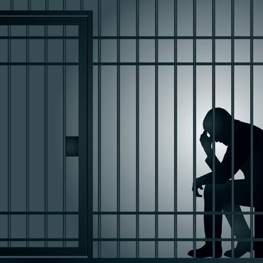 man-imprisoned-in-cell