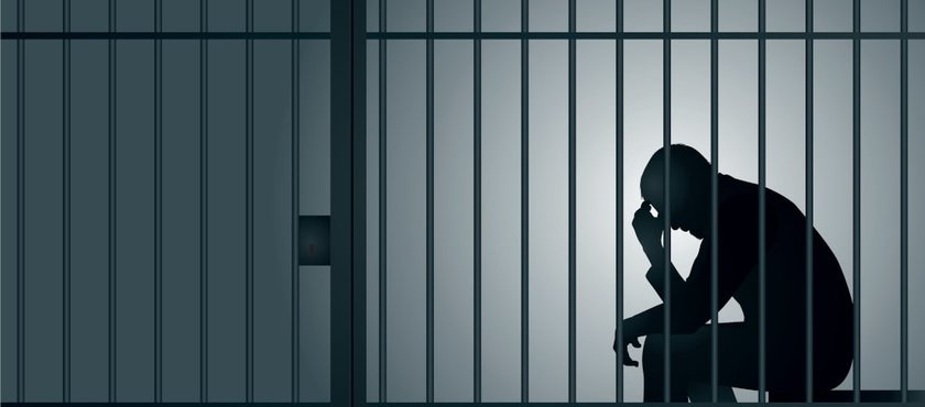 man-imprisoned-in-cell