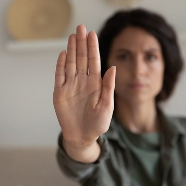 young-concerned-woman-showing-palm