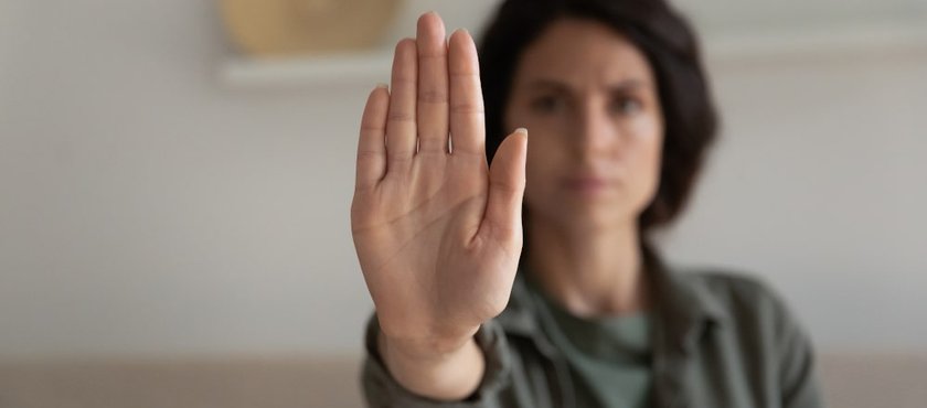 young-concerned-woman-showing-palm