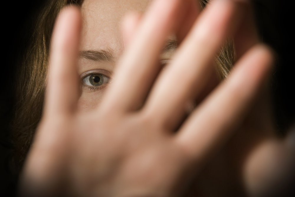 woman-showing-stay-away