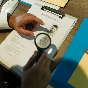 investigator-checking-criminal-record