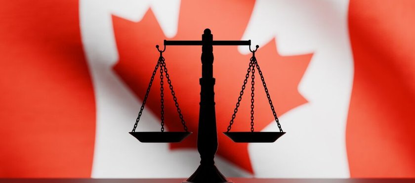 justice-scale-in-front-Canadian-flag
