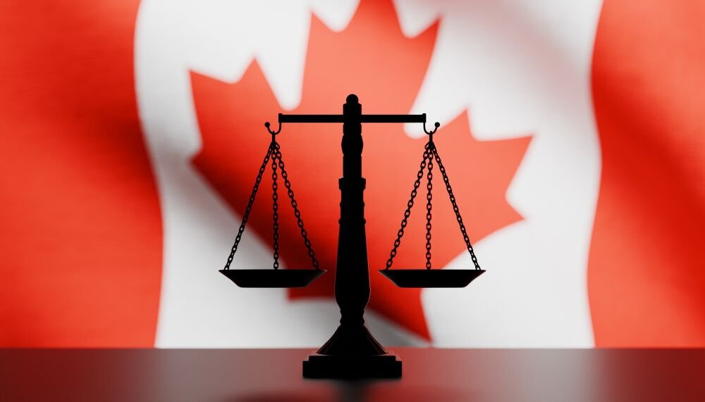 justice-scale-in-front-Canadian-flag