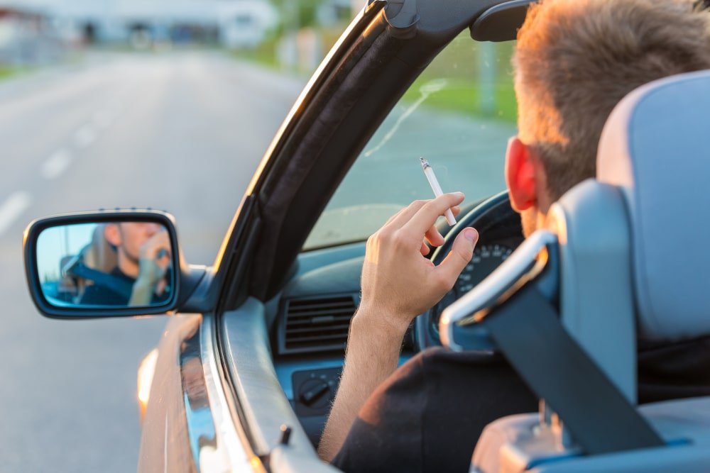 man-cigarette-car