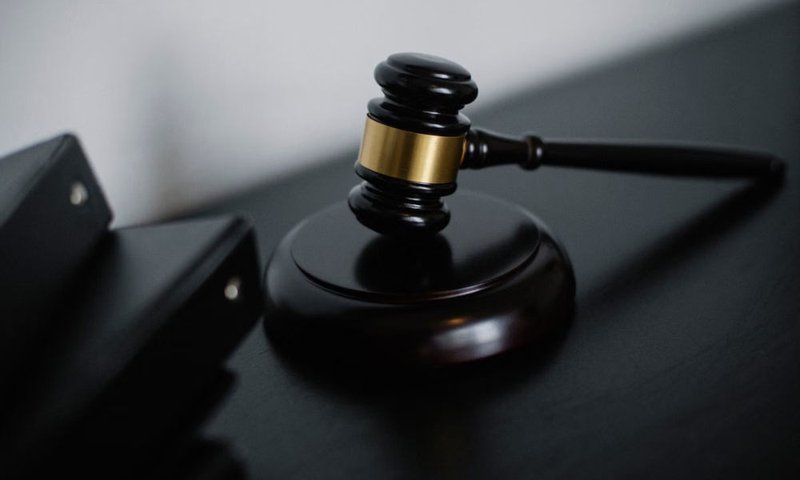 Lawyer’s desk with legal documents, notepad, and counsel materials