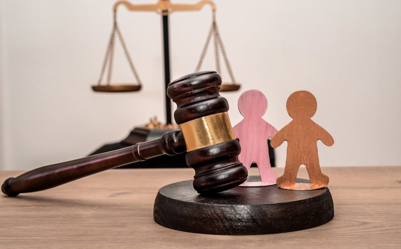 Courtroom gavel and justice scales symbolizing age of consent laws in Canada