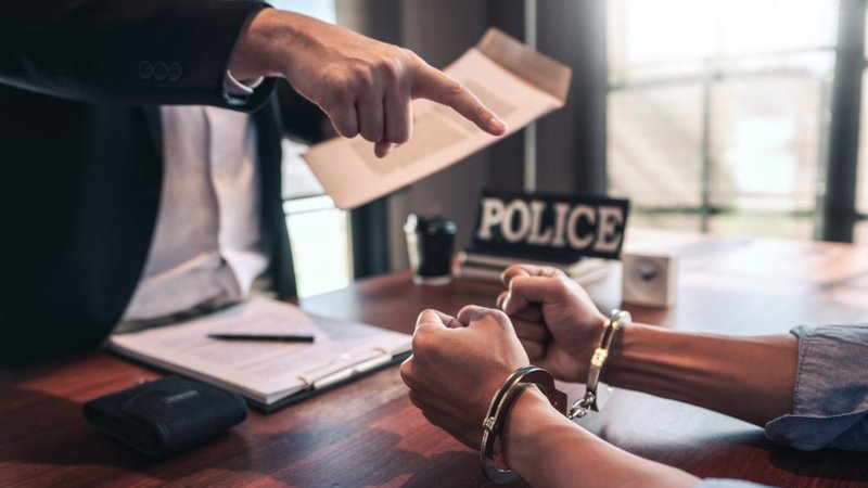 Criminal defence lawyer consulting a client about affidavit submission