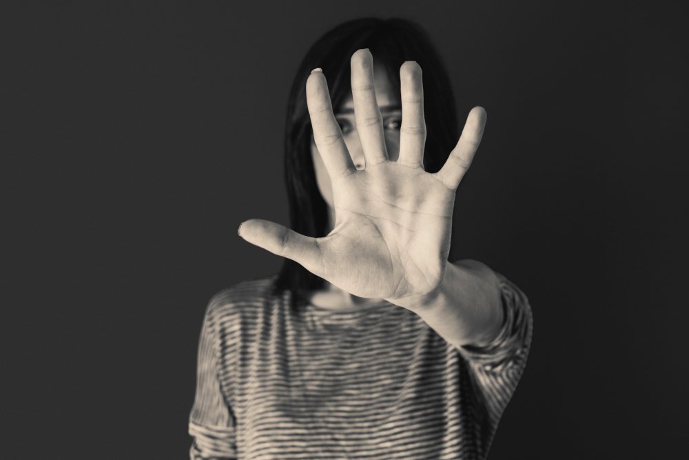 woman-making-stop-gesture-with-her-hand