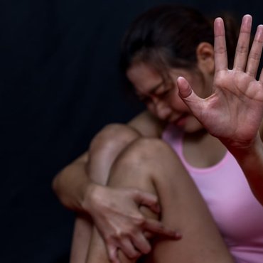 Woman raising her hand to stop or dissuade