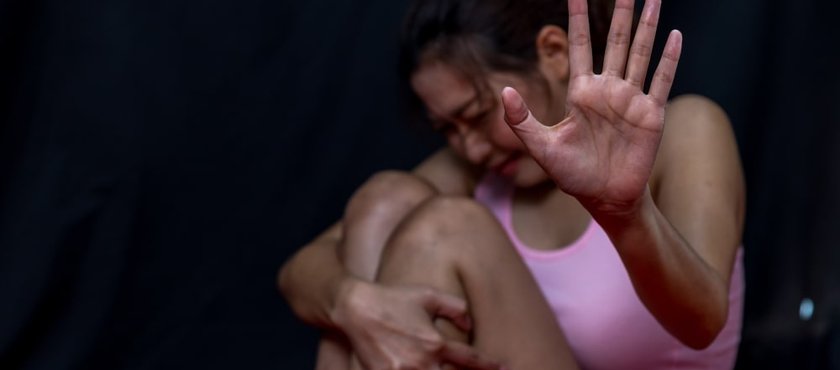Woman raising her hand to stop or dissuade